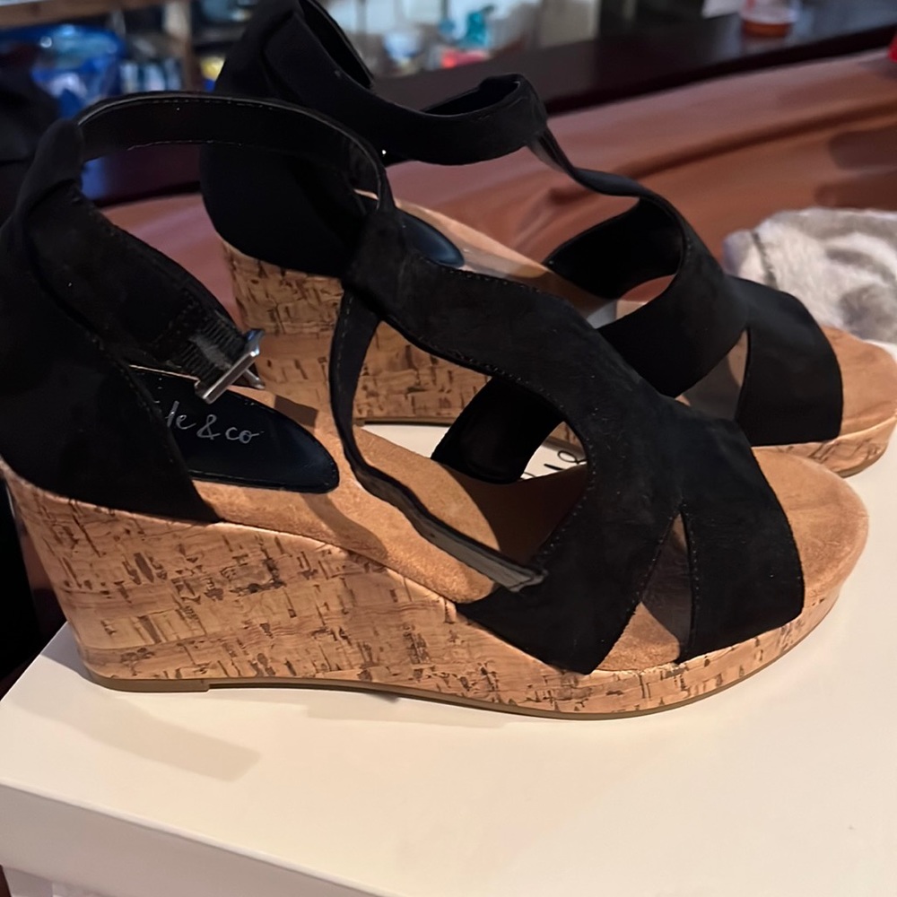 Selling a pair of Selena black style and Company 8.5 size never worn wedges